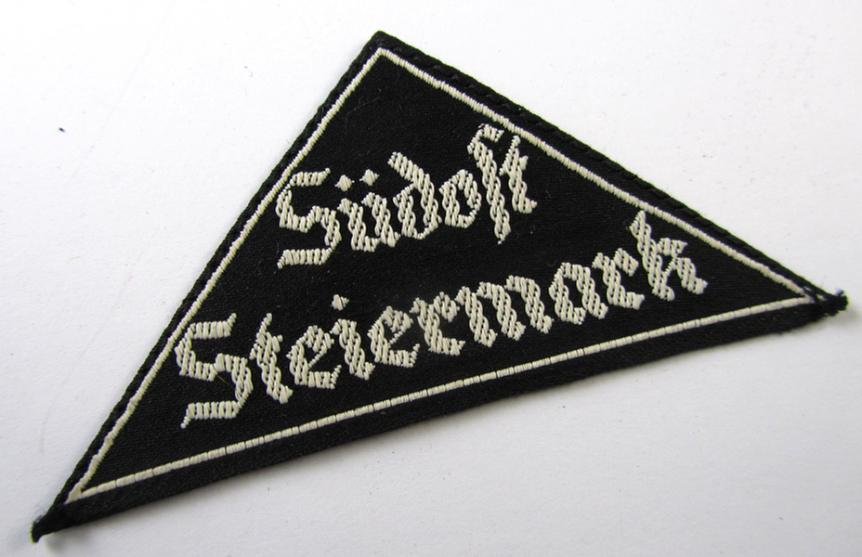 Very nice - and scarcely encountered! - HJ/BDM ('Hitlerjugend'/'Bund Deutscher Mädel') district-triangle entitled: 'Südost Steiermark', still having its original paper 'RzM'-etiket attached - very nice (IMO mint-/unissued!) condition!
