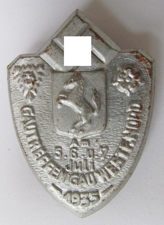 Commemorative, silver-coloured N.S.D.A.P.-related day-badge (ie. 'Veranstaltungsabzeichen' or: 'tinnie') being a non-maker-marked example depicting a provincial-armshield surrounded by the text: 'Gautreffen Gau Westf. Nord - 5.6.u.7. Juli 1935'