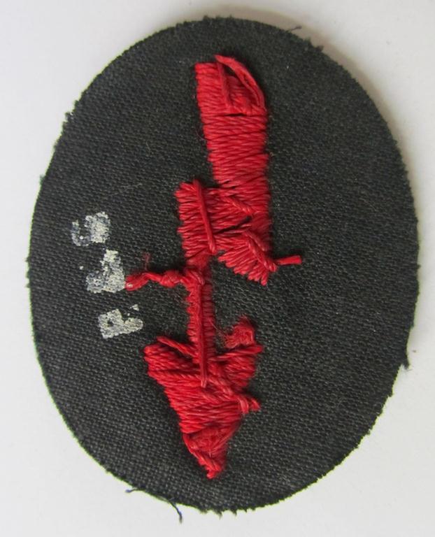 Neat, WH (Heeres) trade- and/or special career-insignia, ie. hand-embroidered signal-blitz, as executed in bright-red, as was intended for a soldier within the: 'Artillerie-Truppen', being a nicely maker-marked example