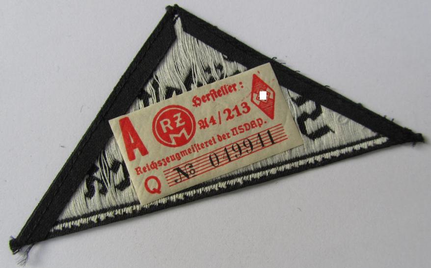 Attractive, 'HJ' ('Hitlerjugend') ie. 'BDM' (or: 'Bund Deutscher Mädel') district-triangle (ie. 'Gebietsdreieck') entitled: 'Südost Steiermark', that comes with its originally attached, paper-based 'RzM'-etiket