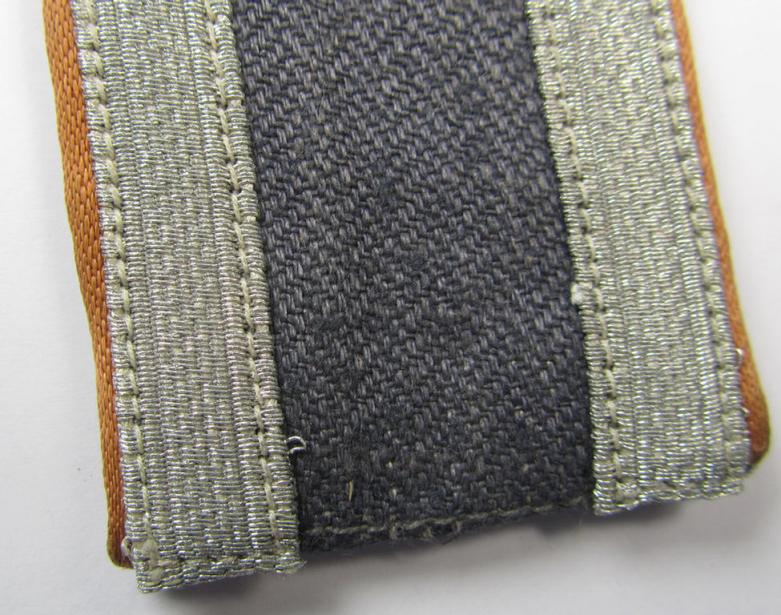 Attractive - albeit regrettably single but nevertheless scarcely seen! - WH (Luftwaffe) NCO-type shoulderstrap as was executed in HBT-type cloth as was intended for an: 'Unteroffizier der Nachrichten-Truppen'