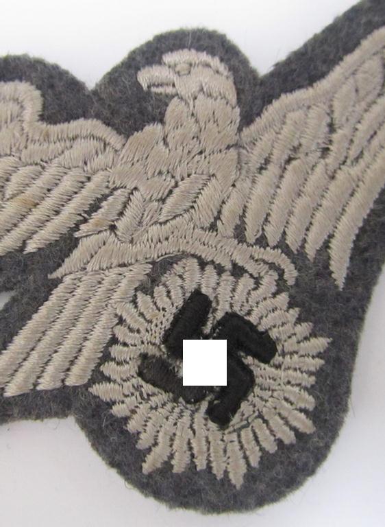 Attractive - and scarcely encountered! - EM- (ie. NCO-) pattern, so-called: 'Luftschutz' (ie. RLB-) breasteagle, being a machine-embroidered example that is executed on a bluish-grey-coloured- and/or woolen-based background