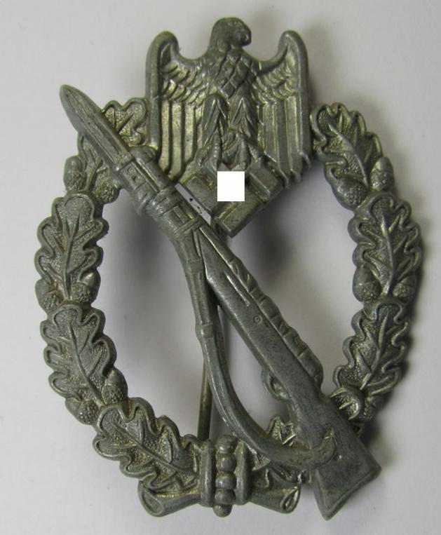 'Infanterie-Sturmabzeichen in Silber' being a non-maker-marked- and/or zinc- (ie. 'Feinzink'-) based specimen of the so-called: 'pillow-crimped'-pattern (as was produced by a to date still unidentified maker)