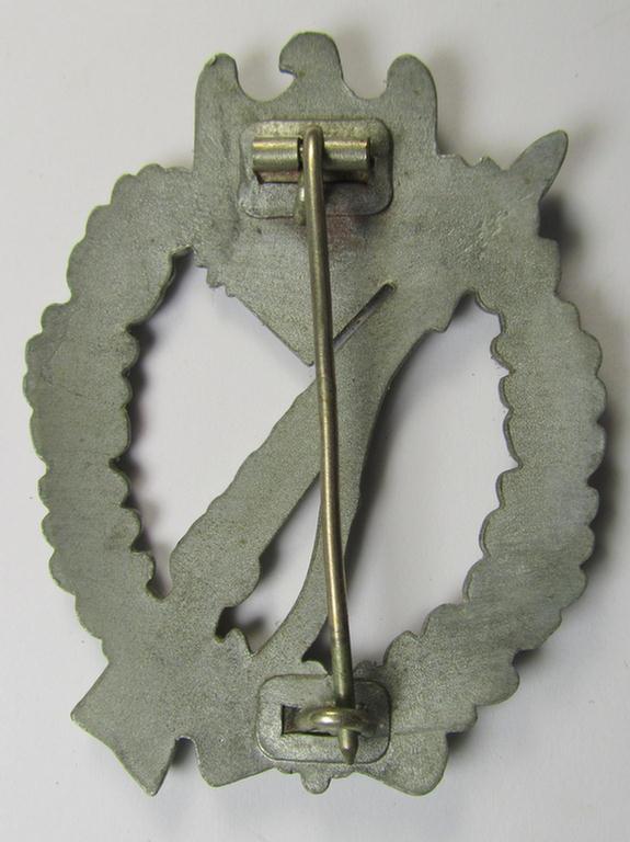 'Infanterie-Sturmabzeichen in Silber' being a non-maker-marked- and/or zinc- (ie. 'Feinzink'-) based specimen of the so-called: 'pillow-crimped'-pattern (as was produced by a to date still unidentified maker)