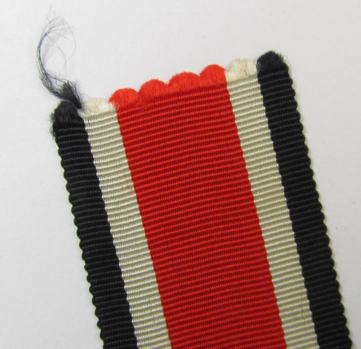 Neat spare-part: a non-confectioned- (ie. full length- ie. 29 cms. long-sized-) ribbon (ie. 'Bandabschitt') as was intended for the: 'Eisernes Kreuz II. Klasse' and that comes in an overall very nice- (ie. 'virtually mint ie. unissued'-), condition
