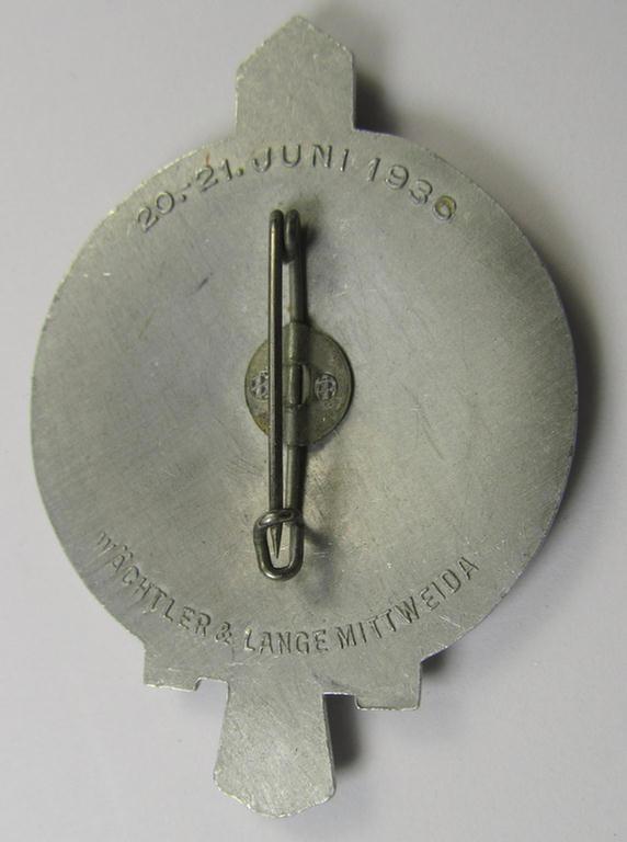 Commemorative, aluminium-based- and/or bright-silver-toned 'N.S.D.A.P.'-related 'tinnie' being a neatly maker- (ie. 'Wächtler u. Lange'-) marked example depicting a 'rounded-styled'-swastika surrounded by the text: 'Gauappell Sachsen 1936'