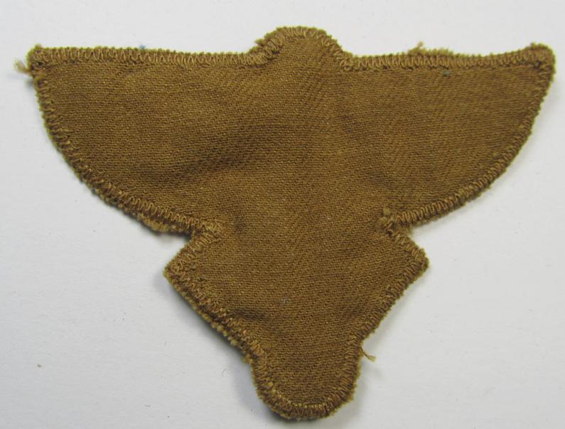 Attractive, tan-coloured, so-called: N.S.F.K.- (or: 'National Socialistisches Flieger Korps') arm-eagle being a nicely woven- (and enlisted-mens'-pattern) example that comes mounted on its piece of tan-coloured wool