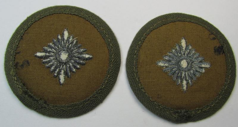 WH (Heeres) 'tropical-pattern', machine-embroidered rank-insignia (ie. roundel) being a neatly maker- (ie. '..u. S.'-) marked example, as was executed in greyish-blue-coloured linnen as was intended for an: 'Oberschütze'