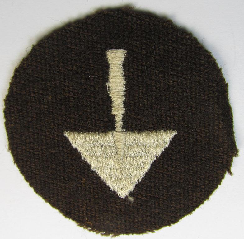 Presumably OT- (ie. 'Organisation Todt'-) related trade- ie. special-career-patch as was specifically intended for a: 'Zimmermann o. Maurer' and that comes in a 'virtually mint' and/or never tunic-attached, condition