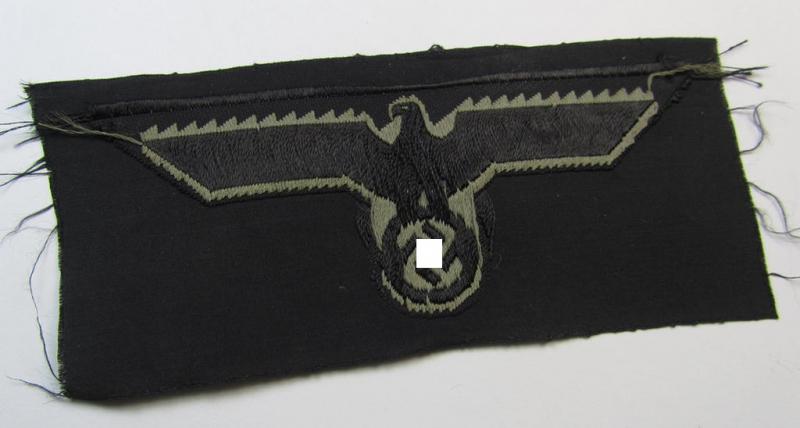 Later- (ie. mid-war-) period, WH (Heeres) 'Panzer'-type breast-eagle (ie. 'Brustadler für Panzertruppen') being a 'virtually mint- ie. unissued' example as executed in bluish-grey-coloured linnen on a black-coloured background