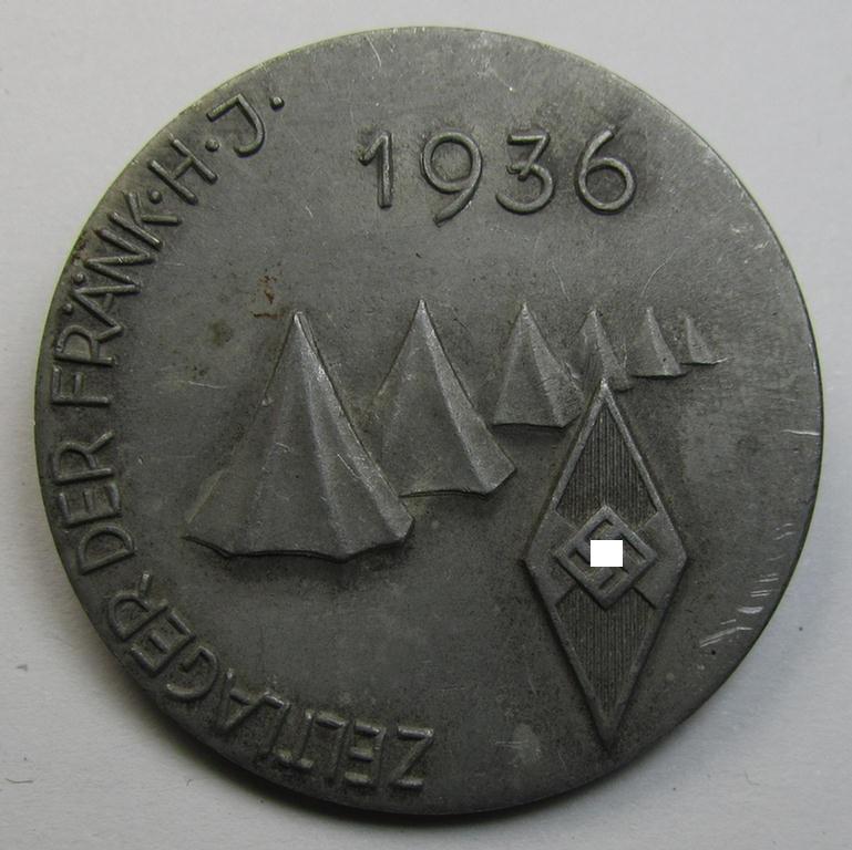 Commemorative - aluminium-based- and/or: greyish-silver-coloured-, 'HJ'-related 'tinnie', being a non-maker-marked example, depicting a 'HJ-Raute' surrounded by the text: 'Zeltlager der Frank. H.J. - 1936'