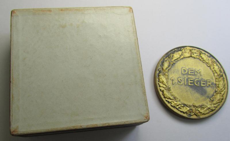 Attractive, golden-toned- (ie. 'Feinzink'-based) so-called: SA- ie. ('Sturmabteilungen'-) related, commemorative-plaque entitled: 'Kampftage der SA - Gruppe Franken - 1938' and showing the text: 'Dem 1. Sieger' and that comes in its period etui