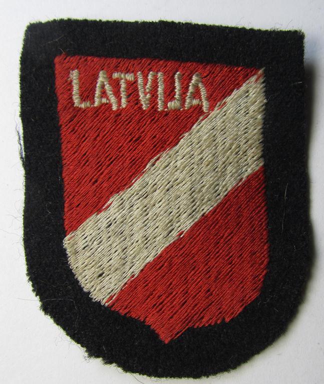 Waffen-SS 'volunteer'-arm-shield as was intended for usage by soldiers of the: '15. o. 19. Waffen-Grenadier-Division der SS' (ie. 'lettische nr. 1 o. 2') and that comes in a 'virtually mint- ie. unissued', condition