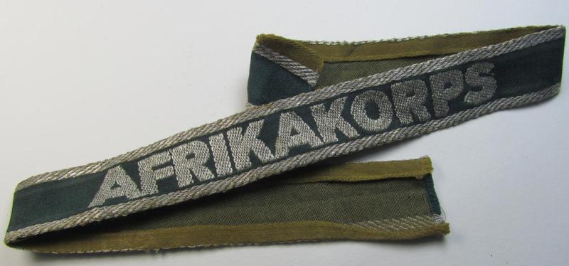 Superb, 'BeVo'-like cuff-title (ie. 'Ärmelstreifen') entitled: 'Afrikakorps' being a with certainty issued and truly worn example that comes in an overall nice- (ie. non-shortened- and most certainly once tunic-attached-), condition