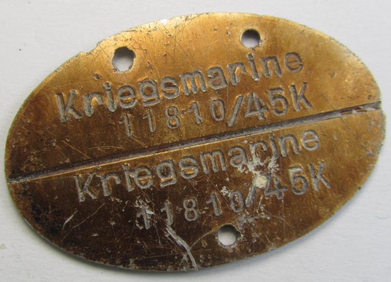 Later-war- (albeit 'standard-issue'-) pattern, WH (Kriegsmarine) typical aluminium-based- and/or bright golden-bronze toned ID-disc (ie. 'Erkennungsmarke') bearing the engraved coded numeral ie. text that reads: 'Kriegsmarine 11810/45K'
