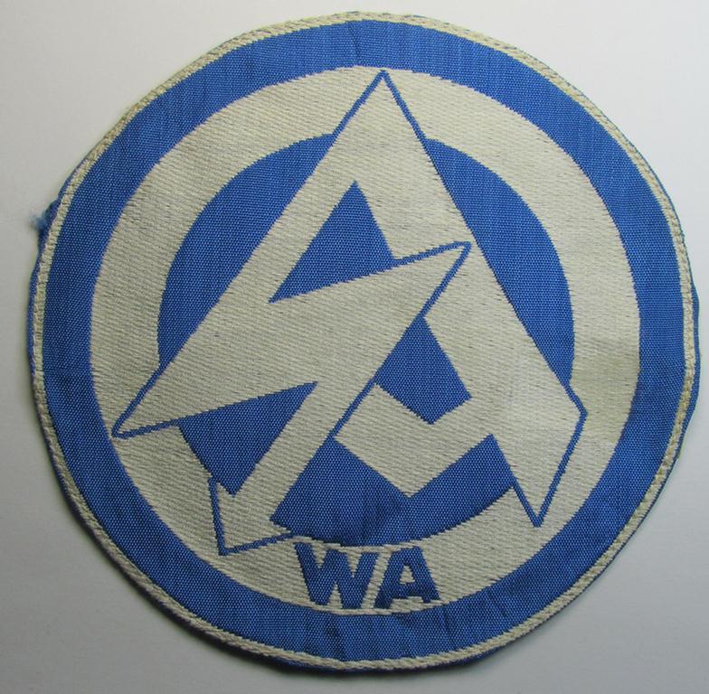 Attractive - and scarcely encountered! - SA (ie. 'Sturmabteilungen'), 'BeVo'-woven sport-shirt insignia still showing its period-attached 'RzM'-etiket as was intended for an SA-member who served within the: 'Gruppe Wartheland' (WA)