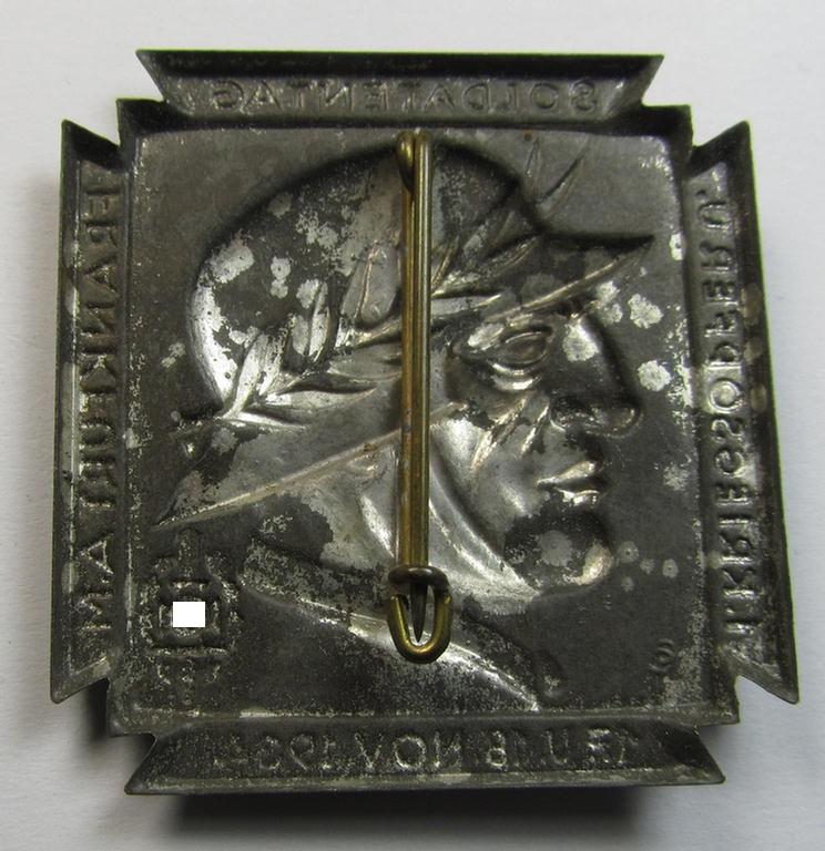 Commemorative, silver-toned and/or tin-based: 'N.S.K.O.V.'-related 'tinnie' being a non-maker-marked example showing a soldier wearing a steelhelmet coupled with the text: '1. Kriegsopfer u. Soldatentag - 17. u. 18. November 1934 - Frankfurt a. M.'