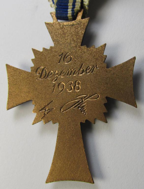 Attractive, 'Ehrenkreuz der deutschen Mutter - dritte Stufe' (or: bronze-class mothers'-cross) that came mounted onto its long-sized ribbon and that came stored in its period pouch (by the maker: 'Jakob Bengel - Idar-Oberstein')
