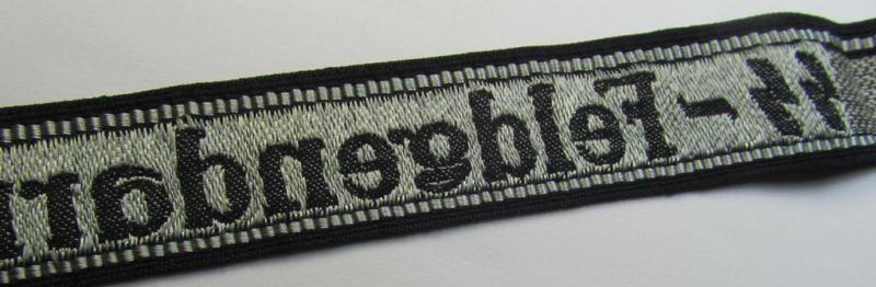 Superb - and truly rarely encountered! - example of a Waffen-SS, 'semi-BeVo'-pattern, EM- (ie. NCO-) type cuff-title (ie. 'Ärmelstreifen') as was intended for a member serving within the: 'SS-Feldgendarmerie'