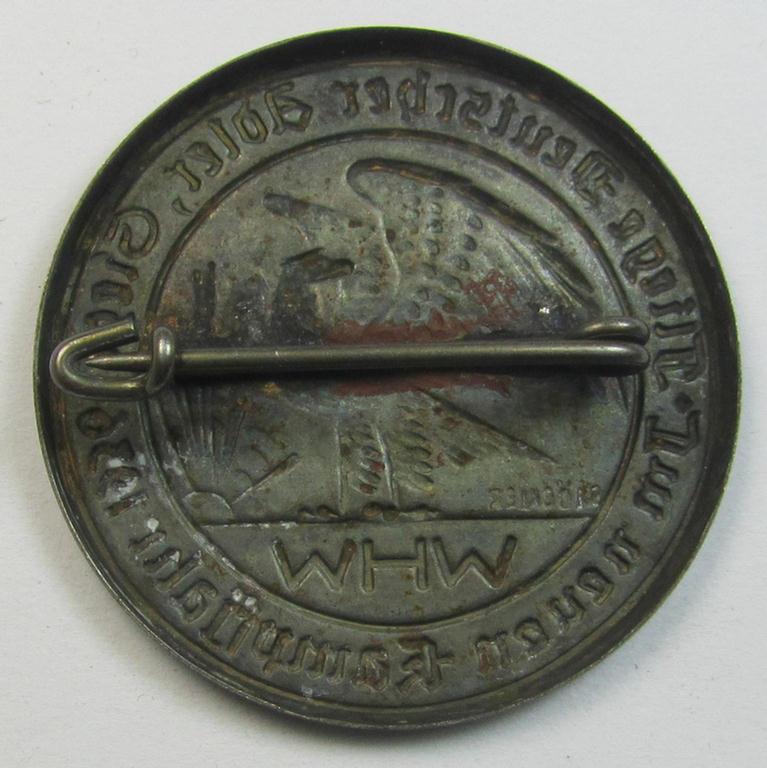 Bright silverish-toned- (and/or typical zinc-based) WHW-related day-badge (ie. 'tinnie' or: 'Veranstaltungsabzeichen') bearing the text: 'Fliege Deutscher Adler Siege - Im neuen Kampfjahr 1936'