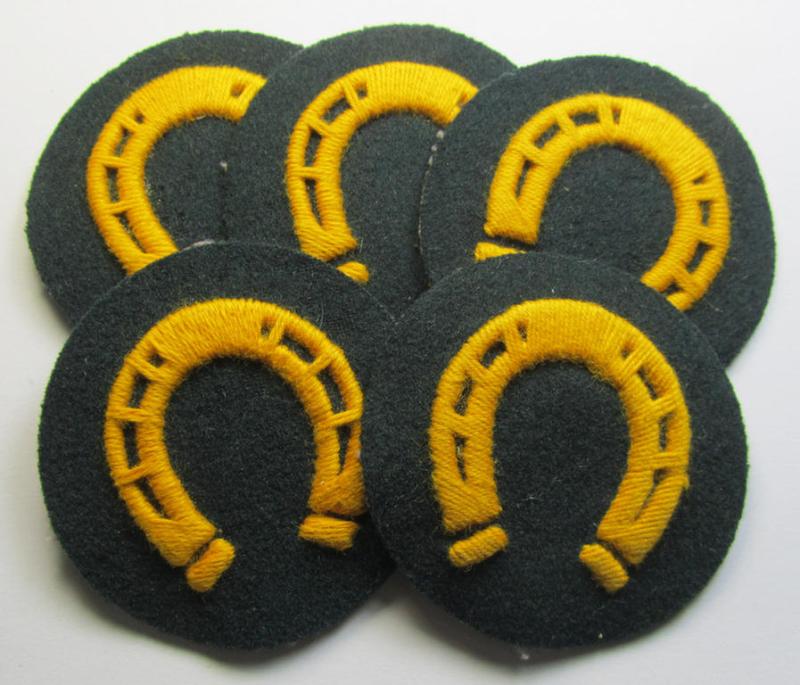 Attractive, WH (Heeres) so-called: trade- and/or special career arm-insignia as was intended for a: 'Hufbeschlagmeister' (or: farrier) being a neatly hand-embroidered 'variant' as executed on darker-green-coloured wool