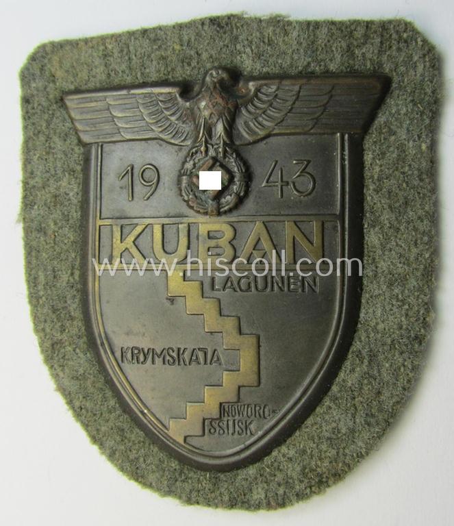 Very attractive - and actually scarcely encountered! - WH (Heeres ie. Waffen-SS) 'Kuban'-campaign-shield that comes mounted onto its original field-grey-coloured- and/or woolen-based 'backing'