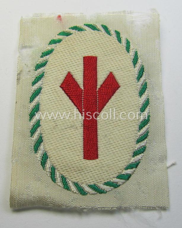 Attractive - and very scarcely encountered! - HJ/BDM (ie. 'Hitlerjugend'/'Bund Deutscher Mädel') trade- or specialist-armbadge as executed in neat 'BeVo'-weave pattern as was intended for a: 'Gefolgschaftsfeldscher'