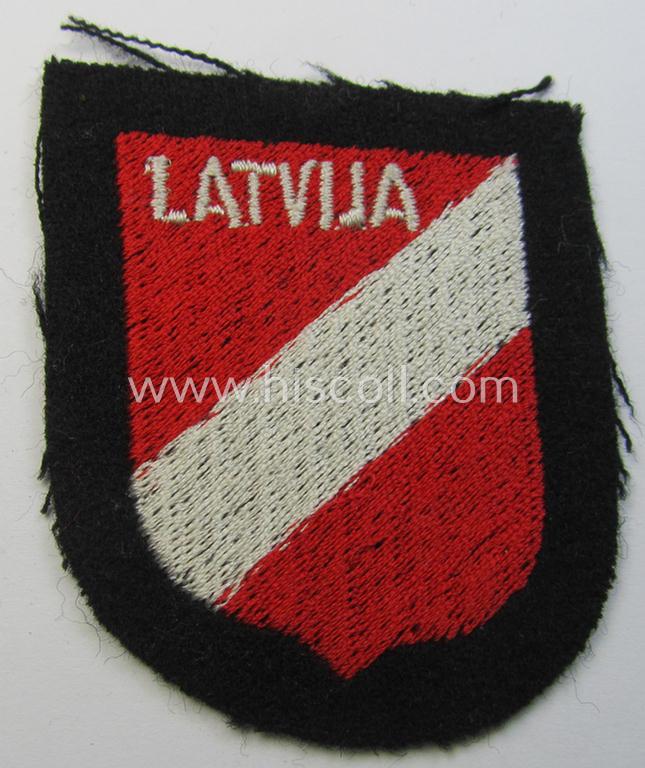 Waffen-SS 'volunteer'-arm-shield as was intended for usage by soldiers of the: '15. o. 19. Waffen-Grenadier-Division der SS' (ie. 'lettische nr. 1 o. 2') and that comes in a 'virtually mint- ie. unissued', condition