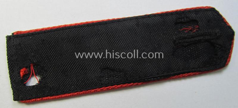 Moderately worn - albeit regrettably single! - bright-red-piped so-called: 'Allgemeine-HJ'-shoulderstrap as intended for a: 'Hitlerjunge' who served within the 'Bann 945' (945 = 'Bann Hermann Göring Werke')