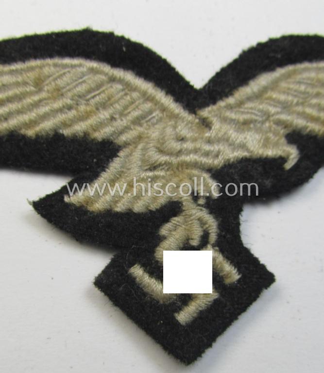 Attractive, WH (Luftwaffe) cap-eagle (being a 'standard-issue'-pattern example that is executed on a black-coloured background and that was as such intended for usage on the black-coloured work- ie. 'HG'-related side-caps ie. 'Schiffchen')