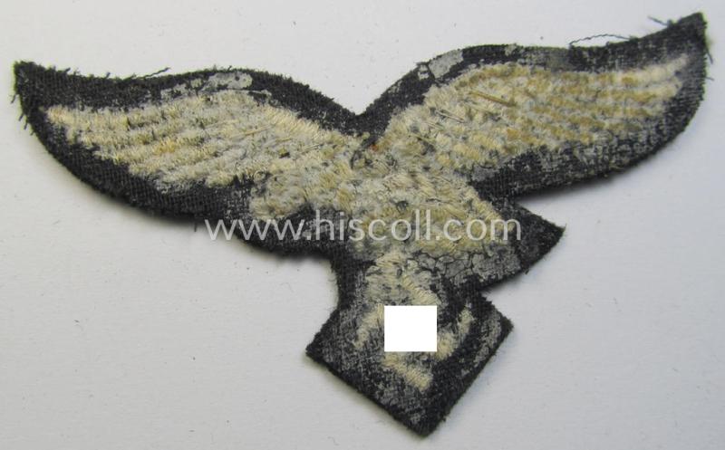 Attractive, WH (Luftwaffe) cap-eagle (being a 'standard-issue'-pattern example that is executed on a black-coloured background and that was as such intended for usage on the black-coloured work- ie. 'HG'-related side-caps ie. 'Schiffchen')