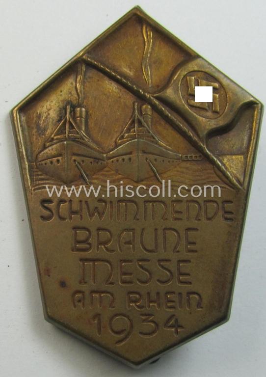 Commemorative - copper-based- and/or copper-coloured - N.S.D.A.P.-related 'tinnie', being a non-maker marked example, depicting a raised swastika-flag and two ships with below the text: 'Schwimmende Braune Messe am Rhein 1934'