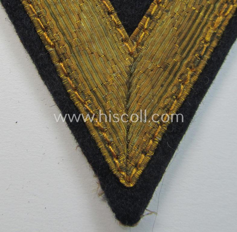 Attractive example of a WH (Kriegsmarine) blue-coloured rank-chevron (ie. 'Gefreitenwinkel') as was intended for a: 'Gefreiter' (as was specifically intended for usage on the various darker-blue-coloured TR-period naval-tunics)