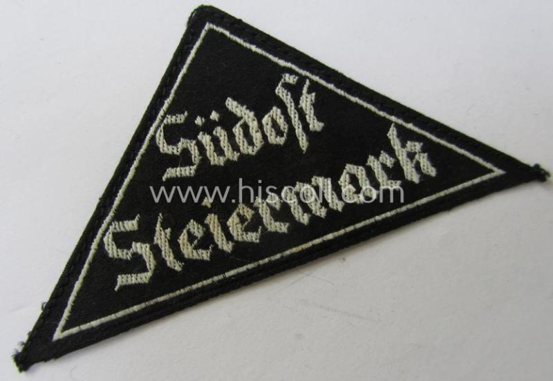 'HJ' ('Hitlerjugend') ie. 'BDM'- ('Bund Deutscher Mädel') district-triangle (ie. 'Gebietsdreieck') entitled: 'Südost Steiermark' (being a hardly used- nor worn example that still retains its period-attached 'RzM'-etiket)