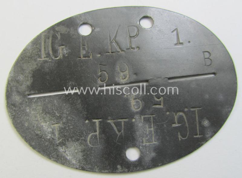 Neat, zinc-based WH (Heeres ie. 'Infanterie'-ralted) ID-disc (ie. 'Erkennungsmarke') bearing the clearly stamped unit-designation that simply reads: 'I.G.E.KP.1.' (ie. 'Infanterie-Geschütz-Ersatz-Kompanie 1')