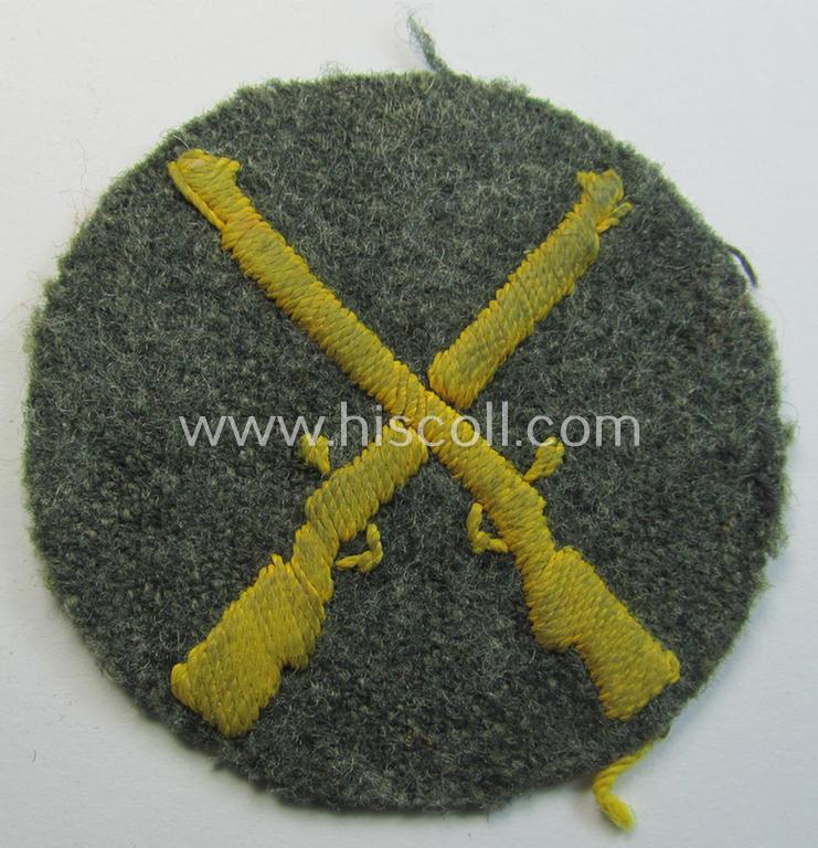Truly used- and/or tunic-removed, WH (Heeres) trade- and/or special-career insignia (ie. neatly hand-embroidered 'Laufbahn- o. Tätigkeitsabzeichen') as was intended for a: 'Waffenmeister' (or: weapon-equipment NCO)