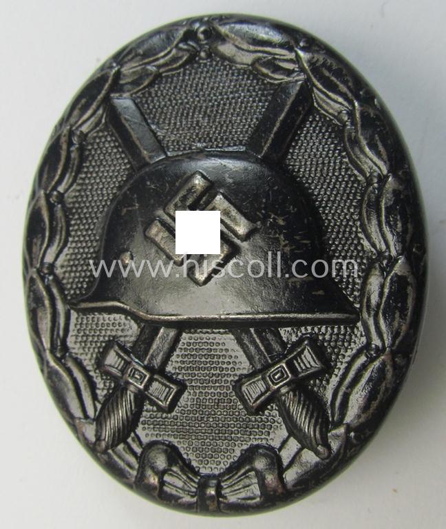 Neatly maker- (ie. 'L/56'-) marked example of a black-class wound-badge (or: 'Verwundeten-Abzeichen in Schwarz') being an example that was produced by the maker (ie. 'Hersteller') named: 'Funcke & Brüninghaus'