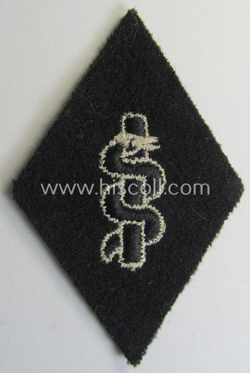 Waffen-SS-pattern, machine-embroidered and/or black- and white-coloured sleeve-insignia (ie. 'Ärmelraute') depicting a so-called: 'Aesculapus'-sign as was used and intended to signify membership within the 'SS-Sanitätsdienst'