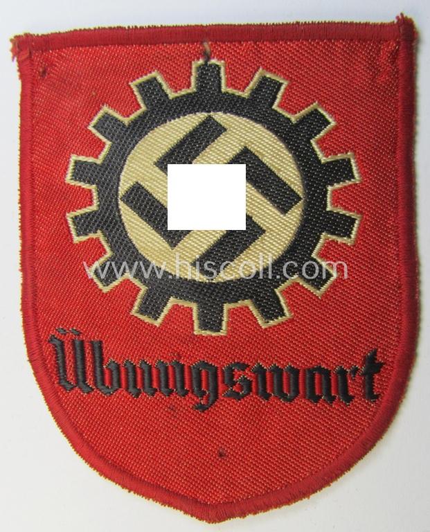 Attractive - and actually scarcely encountered! - D.A.F.- (ie. 'Deutsches Arbeitsfront') specialist-armbadge (ie. 'Tätigkeitsabzeichen') as executed in neat 'BeVo'-weave pattern, as was intended for a: 'D.A.F.-Übungswart'