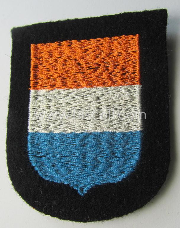 Dutch, Waffen-SS 'volunteer' arm-shield as was specifically intended for usage by soldiers of the: '23. SS Freiwilligen Panzer Grenadier Division' ('Nederland') that comes in a 'virtually mint- ie. unissued', condition