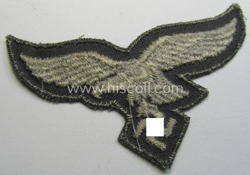 Neat, 'variant'-pattern, WH (Luftwaffe) EM- (ie. eventually NCO-) type side-cap eagle (being a 'virtually mint- ie. unissued' example as executed in typical machine-embroidered-pattern onto an unusally seen 'thin-shaped' background)