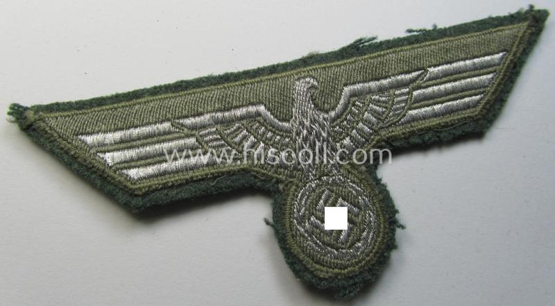 WH (Heeres) breast-eagle as executed in 'BeVo'-type-, so-called: 'flat-wire'-weave-pattern and pre-mounted on field-grey-coloured wool as was specifically intended for usage by soldiers (ie. NCOs) on their dress-tunics (ie. 'Waffenröcke')