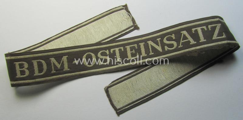 Superb - and rarely encountered! - example of the HJ/BDM- ('Hitlerjugend' ie. 'Bund Deutscher Mädel'-) cuff-title (ie. 'Ärmelstreifen') entitled: 'BDM-Osteinsatz' being an example as executed in the neat 'BeVo'-weave pattern