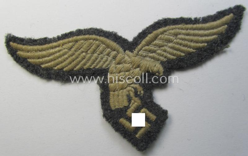 WH (Luftwaffe) enlisted-mens'- (ie NCO-) pattern, machine-embroidered breast-eagle (showing a 'down-tailed'-eagle and being an early- ie. pre-war-period example) that comes in a moderately used- ie. once tunic-attached, condition