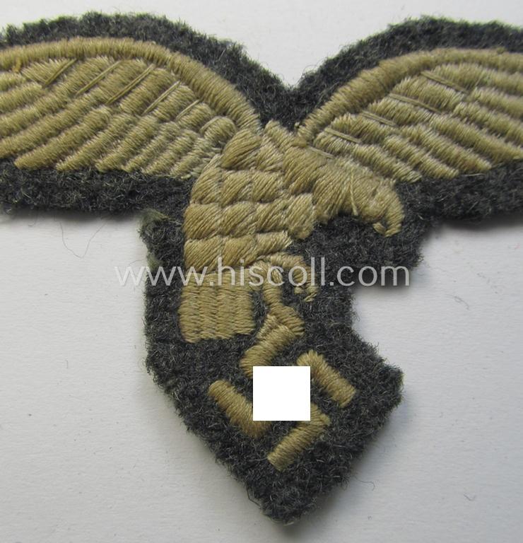 WH (Luftwaffe) enlisted-mens'- (ie NCO-) pattern, machine-embroidered breast-eagle (showing a 'down-tailed'-eagle and being an early- ie. pre-war-period example) that comes in a moderately used- ie. once tunic-attached, condition
