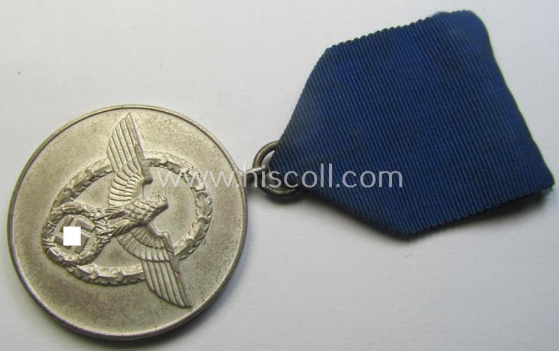 Attractive, bright-silver-toned so-called: 'Polizei-Dienstauszeichnung der 3. Stufe' (or: police loyal service medal of the 3rd class as was awarded for 8 years of service) that comes mounted on its period ribbon (ie. 'Bandabschnitt') as issued