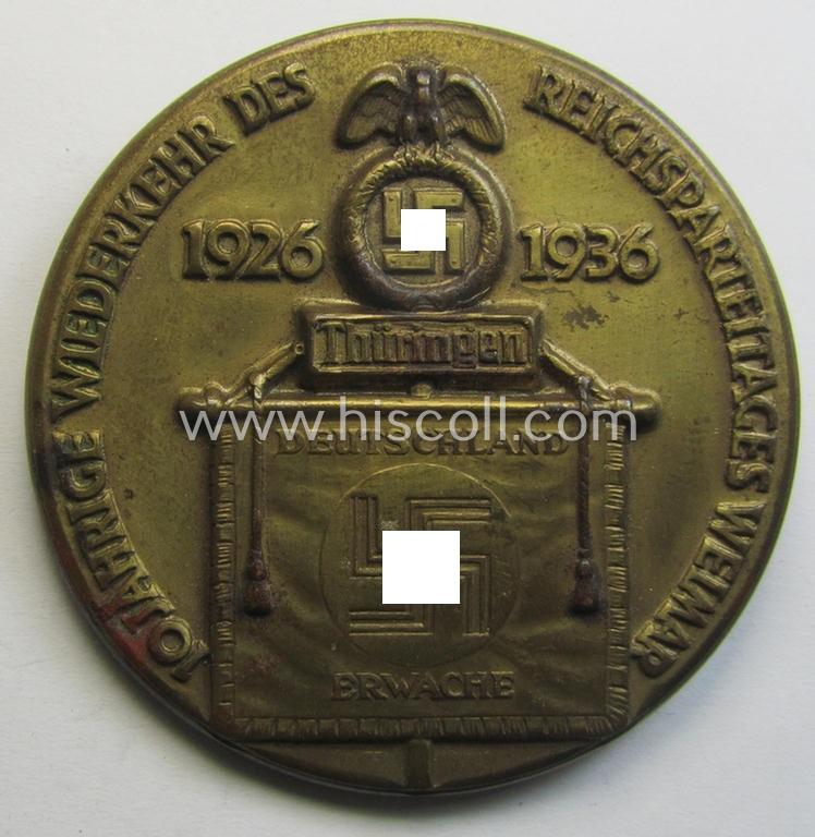 Very detailed, golden-bronze-toned N.S.D.A.P.-related day-badge (ie. 'tinnie' or: 'Veranstaltungsabzeichen') as was issued to commemorate a party-related meeting: '10 Jahrige Wiederkerhr des Reichsparteitages Weimar - 1926-1936'