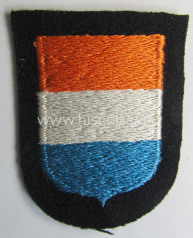 Dutch, Waffen-SS 'volunteer' arm-shield as was specifically intended for usage by soldiers of the: '23. SS Freiwilligen Panzer Grenadier Division' ('Nederland') that comes in a 'virtually mint- ie. unissued', condition