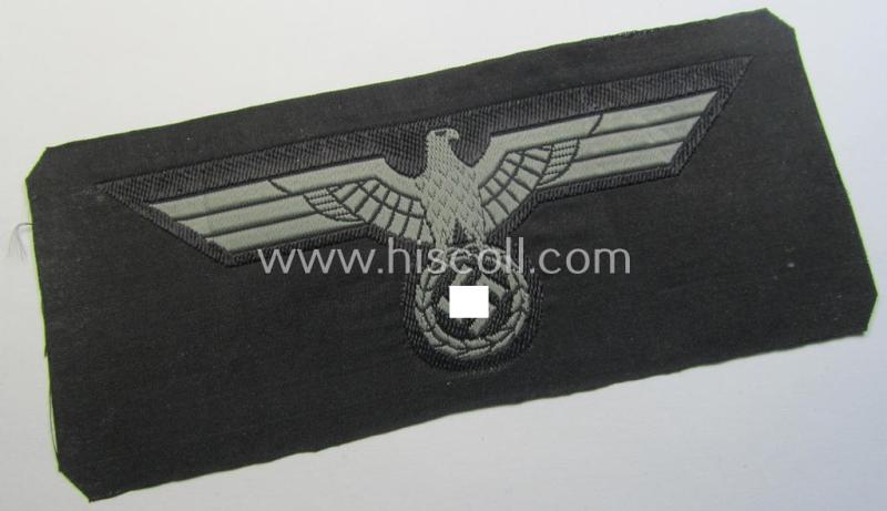 Later- (ie. mid-war-) period, WH (Heeres) 'Panzer'-type breast-eagle (ie. 'Brustadler für Panzertruppen') being a 'virtually mint- ie. unissued' example as executed in bluish-grey-coloured linnen on a black-coloured background