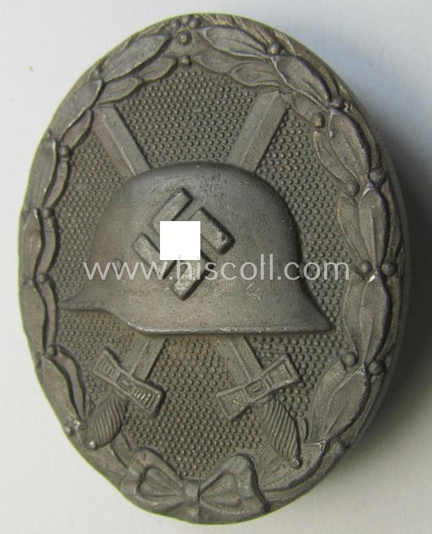 Attractive - and moderately used- and worn! - example of a maker- (ie. '65'-) marked example of a silver-class wound-badge (or: 'Verwundeten-Abzeichen in Silber') as was produced by the 'Hersteller' ie. maker: 'Klein u. Quenzer'